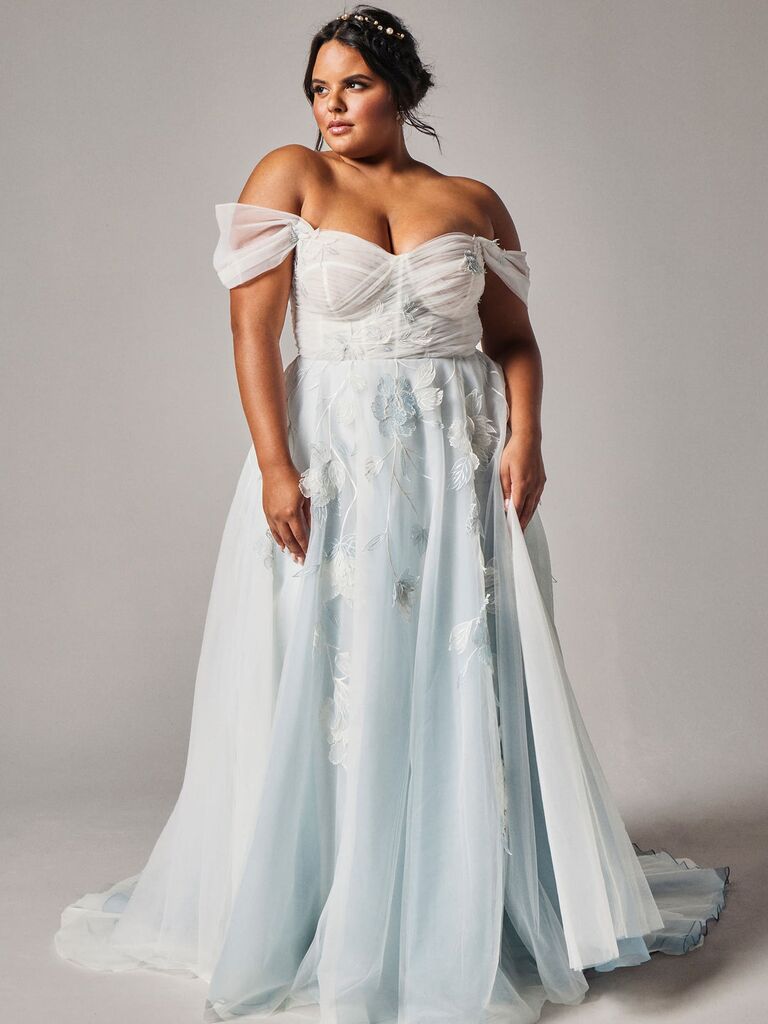 Strapless white and blue wedding dress by Rebecca Schoneveld. 