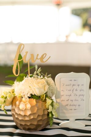 Gold Table Numbers in Gold Vases with White Flowers