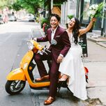 Brides on scooter after wedding