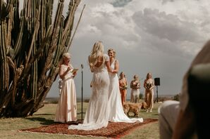 Bride in Beaded Gown and Bride in Sleek Gown, Ceremony on Ornate Rug Altar, Towering Cactus