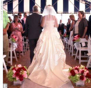 With the waves crashing on the shore only 100 feet away, the couple recited two sets of vows -- ones they had written themselves and a more traditional set -- while under a tent overlooking the sand dunes and ocean below. “We didn’t need a lot of decoration, because the scenery was more than enough,” Elizabeth says. To make the moment even more memorable, the sun began to set just as Elizabeth walked down the aisle with her father.