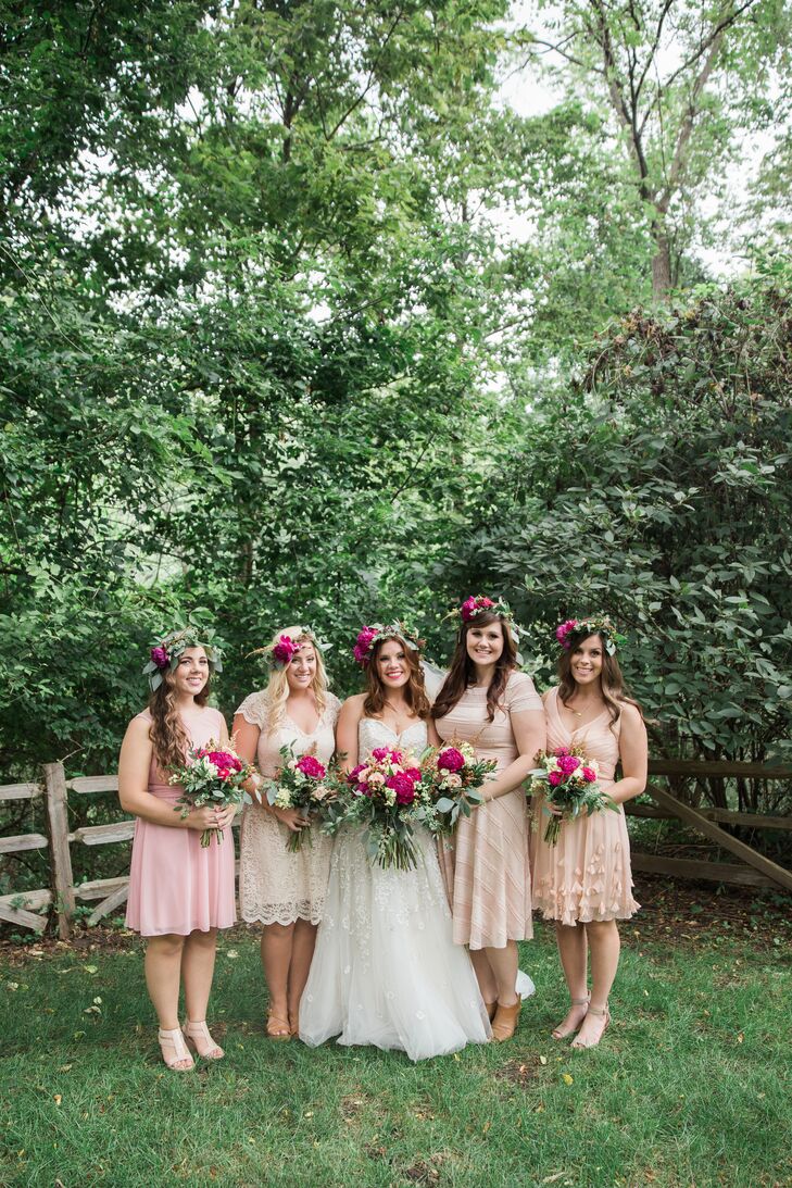 The bridesmaids' mismatched neutral dresses were paired with coordinating flower crowns for a distinctive yet cohesive look.