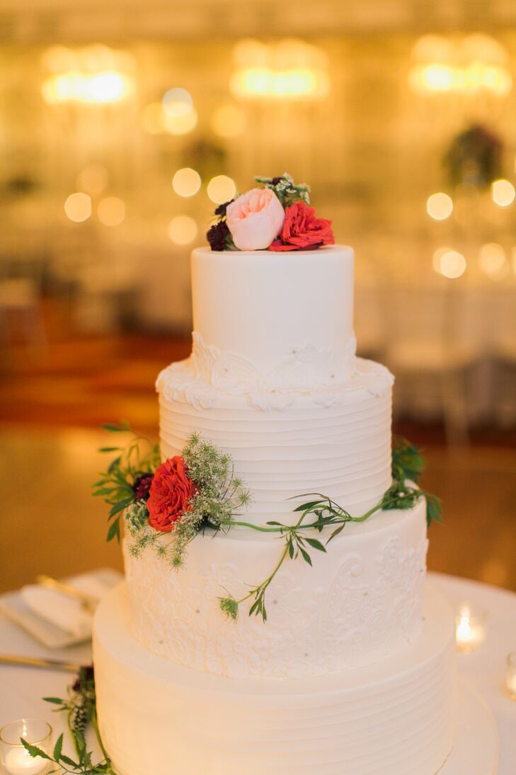Small pink and red roses decorated the three tier white cake by Cake Sweet Food Chicago.