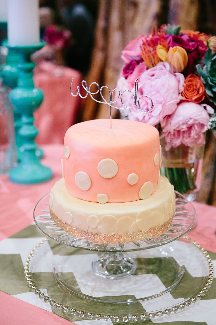 A Whimsical Pink Polka Dot Wedding Cake with Wire Cake Topper