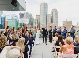 For Angela and Michael (Mike),  an unconventional wedding day was a must. After a ceremony on The Envoy Hotel roof deck, guests sipped pineapple sprit