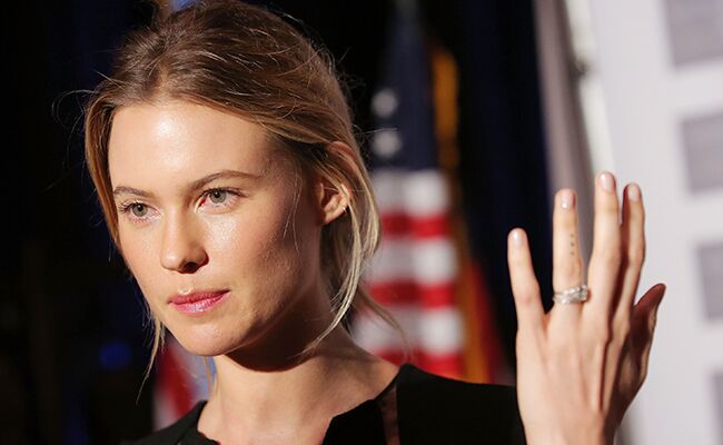 Behati Prinsloo shows off her wedding ring and tattoo