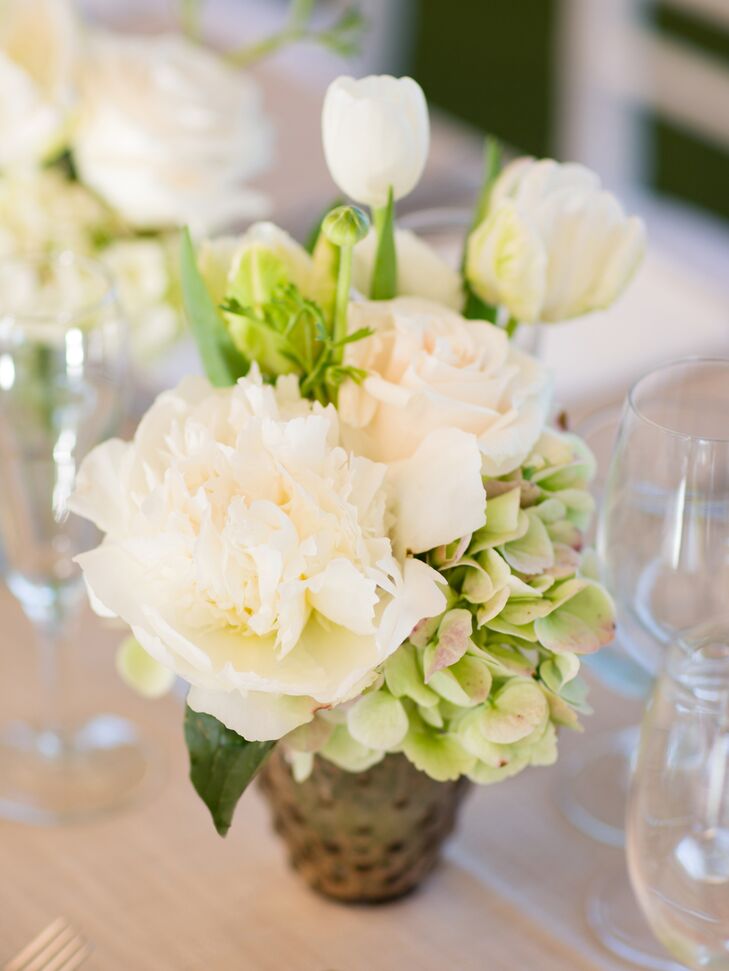 Small arrangements of white peonies, tulips and green hydrangeas decorated the long main reception table.