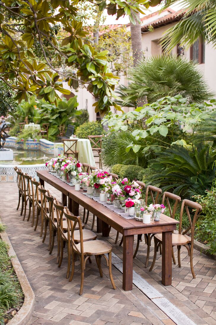Alicia and Ian kept their dinner reception look casual by forgoing linens and topping tables with runners and blooms.