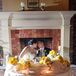 Lush yellow gerbera daisies decorated the couple's sweetheart table.