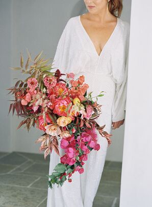 Bride in White Jumpsuit With Cascading Bougainville Bouquet