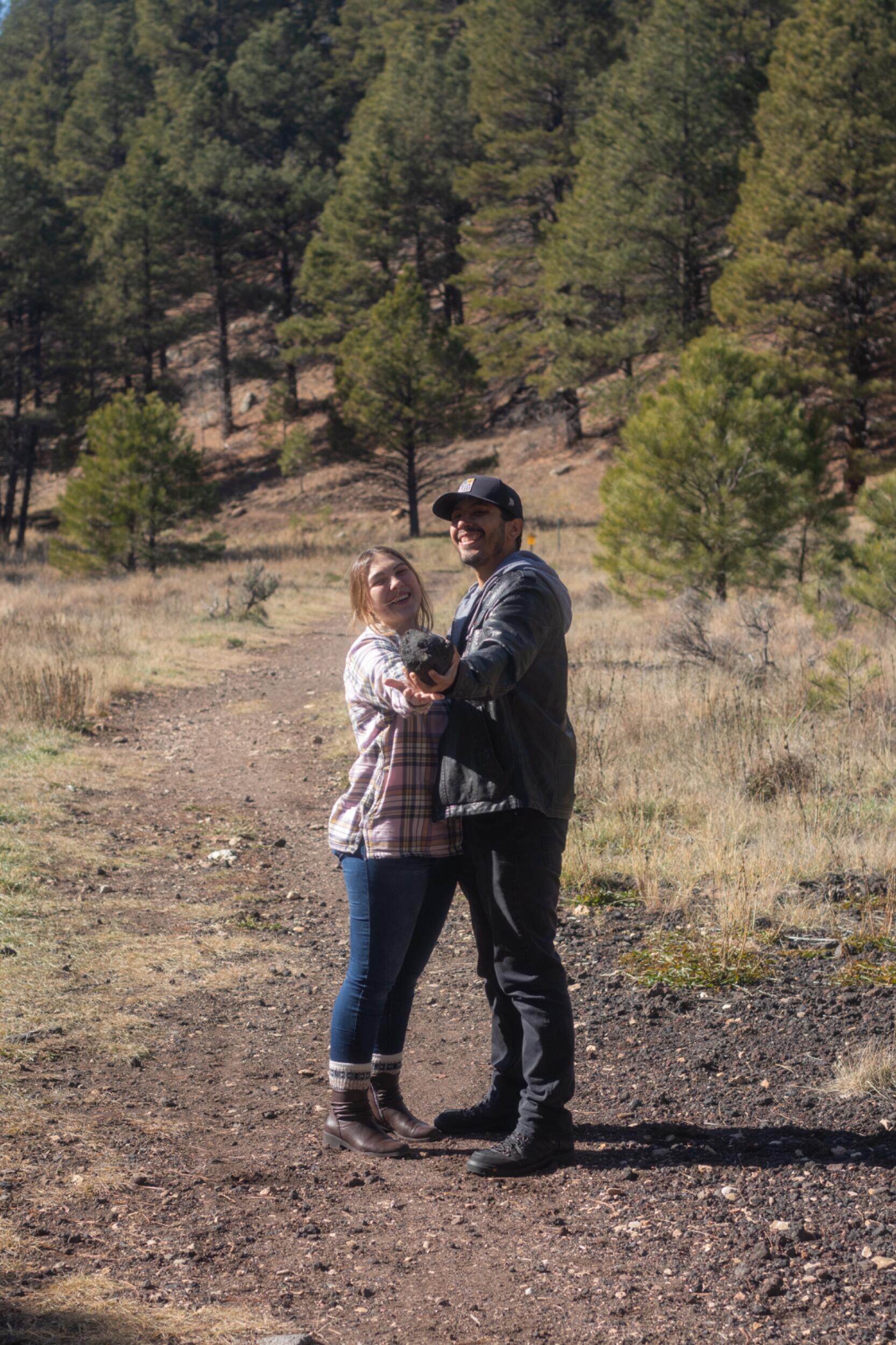 We went back to our favorite trail in Flag! We wanted to recreate our famous snowball picture, but there was no snow. So we got a really nice rock.