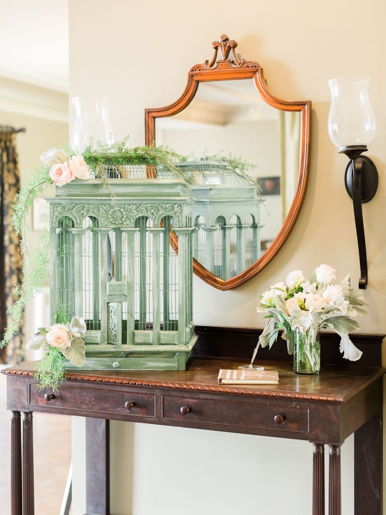 wedding gift table with mint green antique bird cage as unique card box idea