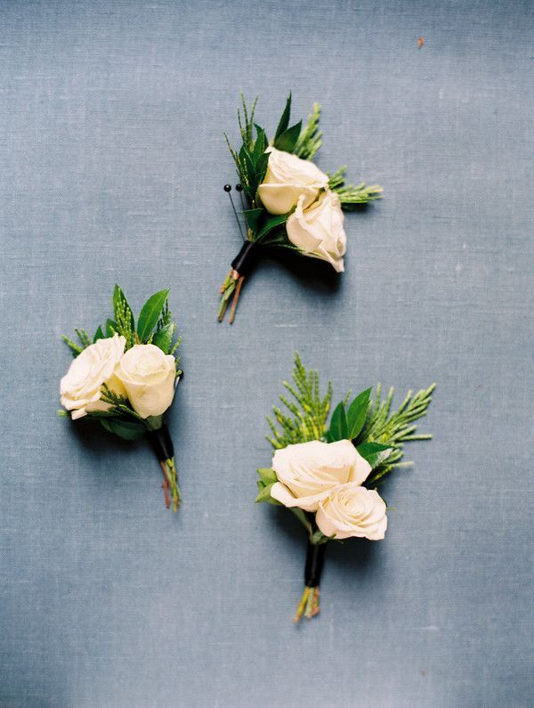 Three white boutonnieres