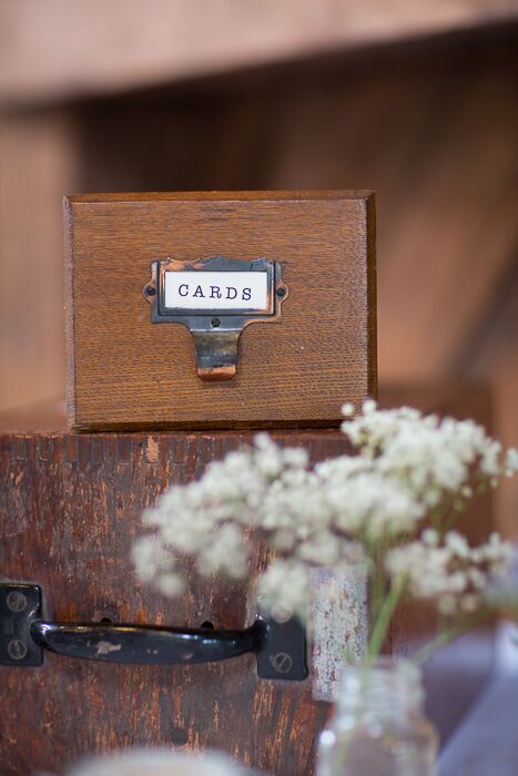 Guests left cards in a vintage library card drawer.