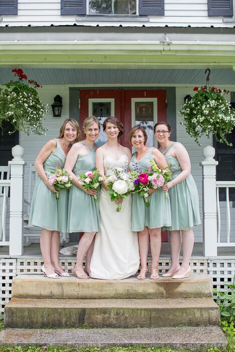 The bridesmaids wore knee length mint dresses with different necklines.
