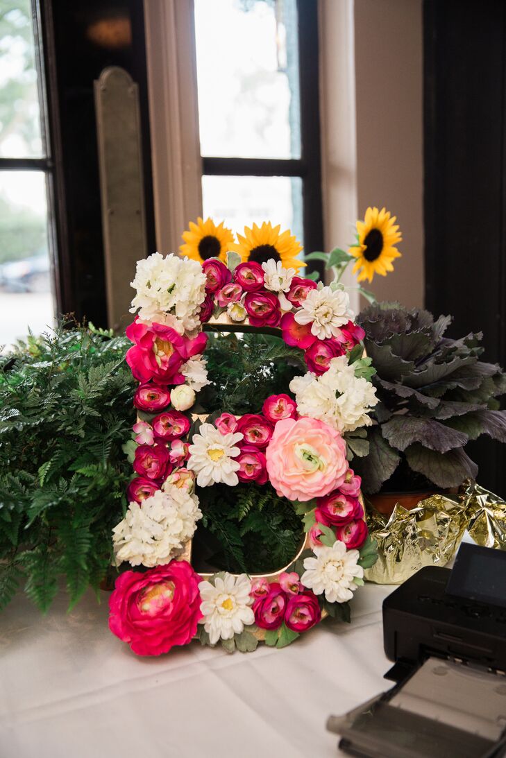 This flower-adorned initial paid homage to the couple's newly shared last name.