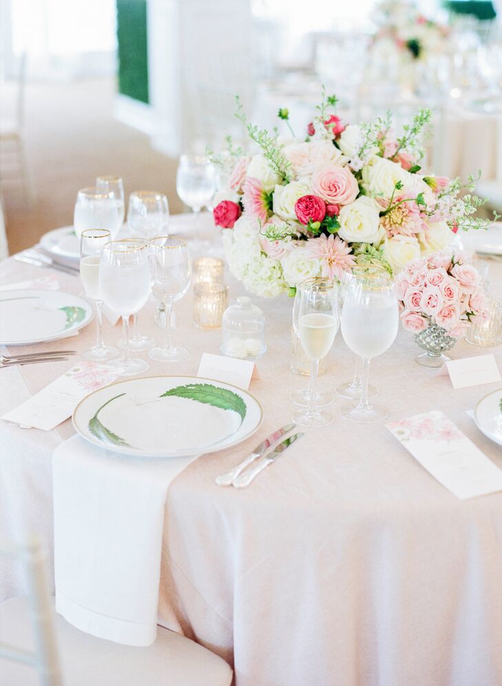 Tables were adorned with blush linens and floral arrangements of roses, dahlias and hydrangeas.