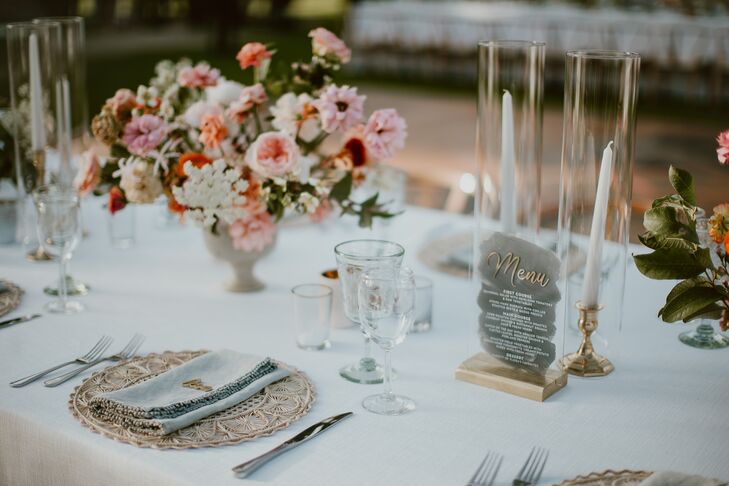 Romantic Dining Table with Flower Centerpiece, Candles and Menu