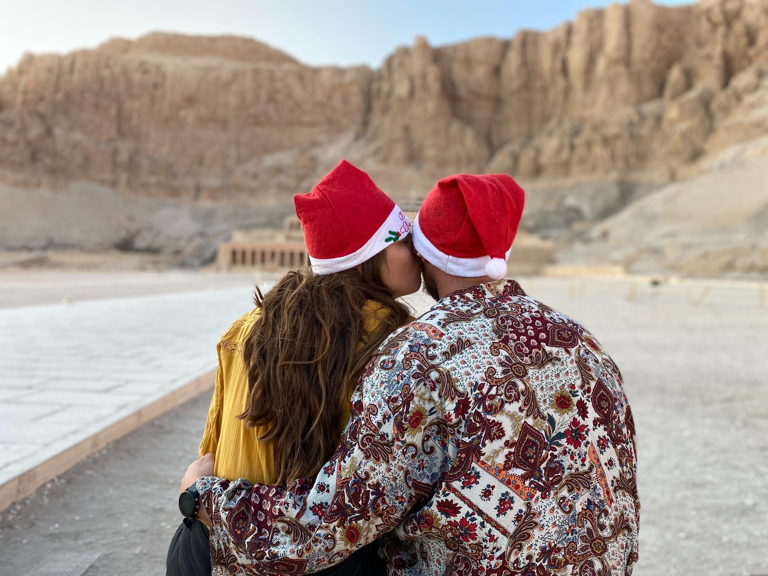 Our first Christmas together — in Egypt.
Because nothing says “festive” like Santa hats in the desert.