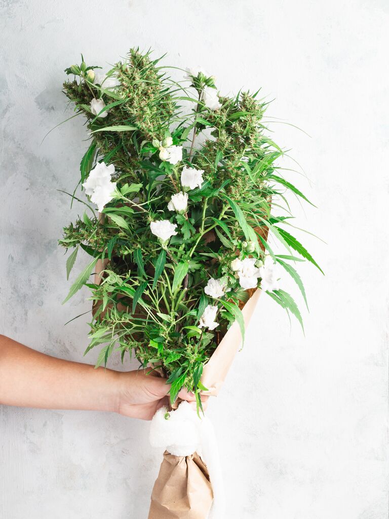 Bouquet of white flowers and cannabis.