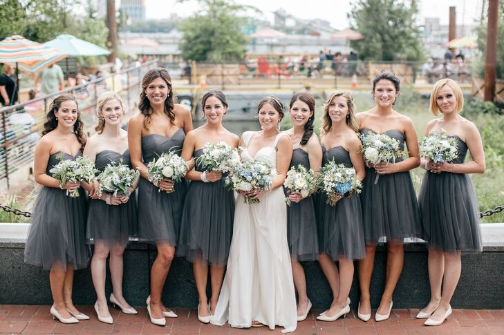 “I tried to keep everything fairly basic so that certain elements, like the floral arrangements and the vintage-inspired cuffs I got for the girls, would stand out,” Samantha says. She chose a simple strapless chiffon dress by Jenny Yoo in a neutral charcoal gray hue for all the girls to wear, which they then paired with pale clay-colored pumps.