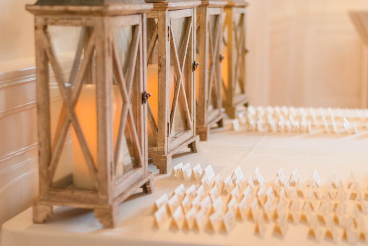 Candle lanterns lined the back of the table where the folded escort cards were displayed.