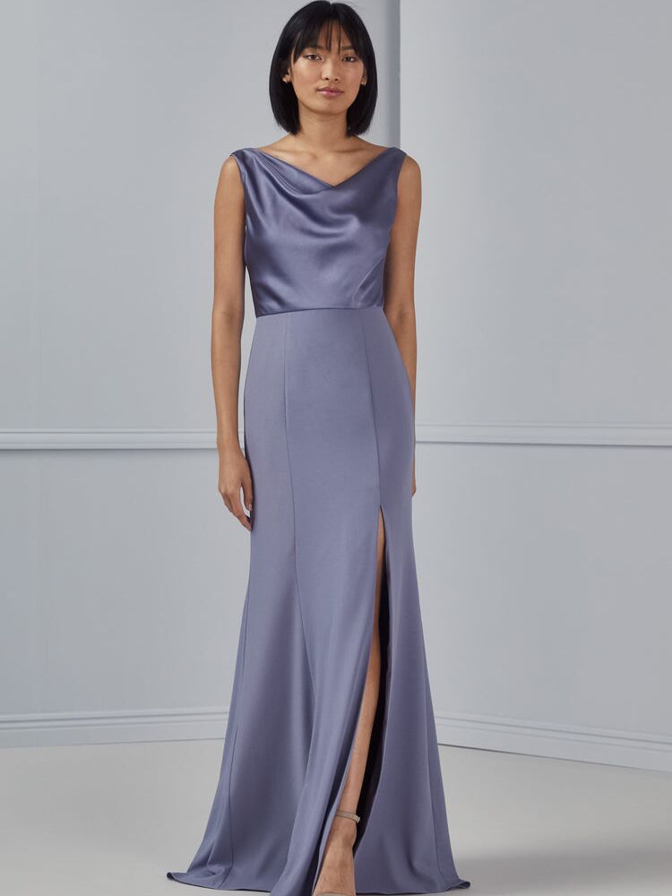 Model wears a satin cowl neck dress. 