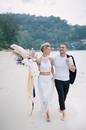 Bride With Pampas Grass Bouquet Walking on Beach With Groom in Thailand