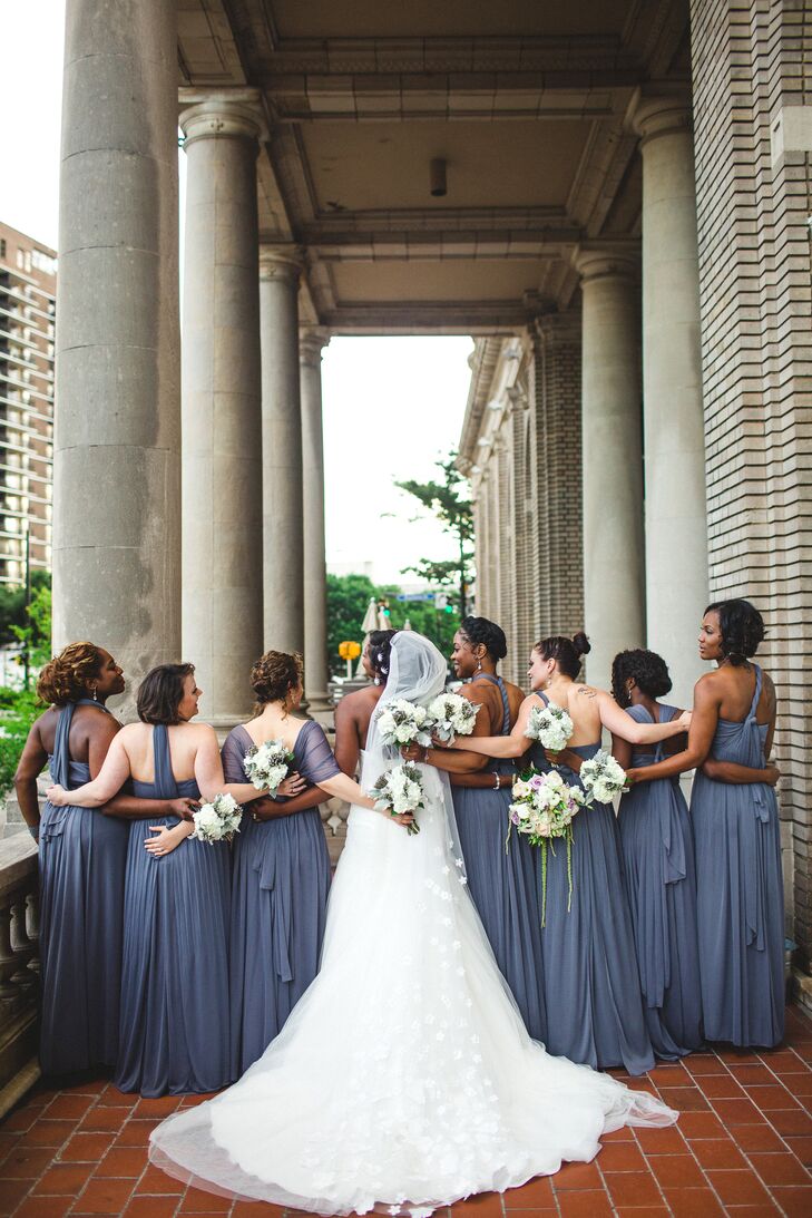 “I wanted the bridesmaid dresses to fit their personalities but still have an overall sense of uniformity,” says Rachel, who selected a gray chiffon dress from David’s Bridal that had a variety of styles. “We added a crystal sash, their earrings were gifts from me, and each sported braids or curls to match my style.”