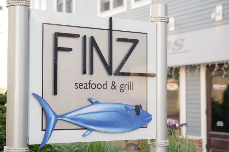 With a nautical theme in mind, Katie and Steve set out to find a venue that would fit their wedding day style. Finz Restaurant, located at Pickering Wharf in Salem, Massachusetts, was the ideal spot, offering a prime waterfront location only minutes away from the ceremony site, fresh seafood and a warm, inviting ambiance.