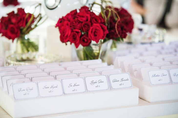 Pops of crimson added vibrancy to the reception's crisp white decor.