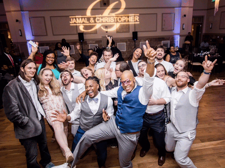 Group smiling on the dance floor.