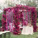 The mandap was decorated with magenta bougainvilla and accents of jasmine. Indhu's grandmother designed a kolam, a south Indian design made with flowers that brings good luck during auspicious occasions, that was placed in front of the mandap.