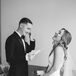 Black-and-White Photo of Bride and Groom Reading Personal Letters Before Ceremony