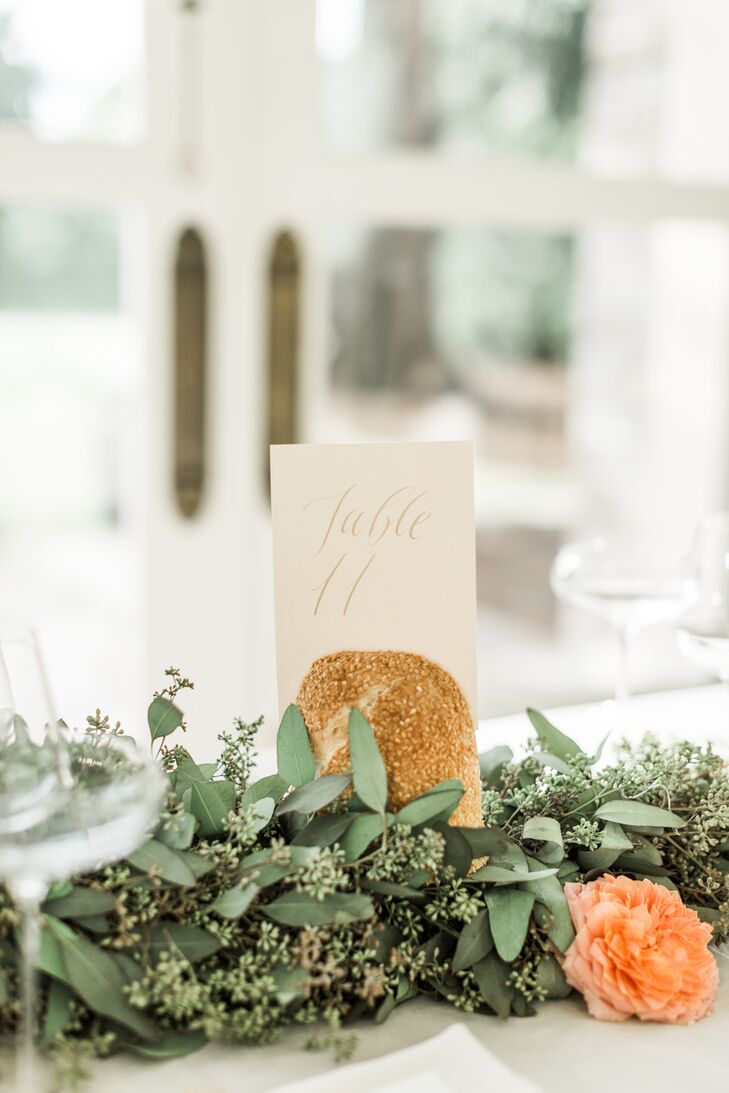 Gold detailing and handwritten calligraphy gave the reception table numbers a soft, elegant look.