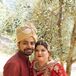 Interfaith Bride and Groom in Red and Gold Lehenga and Kurta