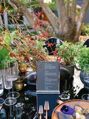 Centerpiece With Branches on Black Acrylic Table