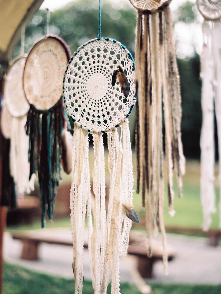 All the decor for the wedding was made by Jenna and Jon with the help of their friends and family members. Details such as macrame plant hangers, lace dream catchers and fringe-trimmed tablecloths gave the spacious open-air tent a decidedly bohemian feel.
