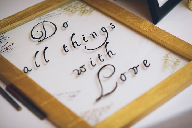 The couple welcomed all 125 guest into their ceremony with the help of a unique guest book. Gold-framed glass served as just that with the words “do all things with love” printed along the front. Friends and family members stopped to write their names, well wishes and notes around the design.