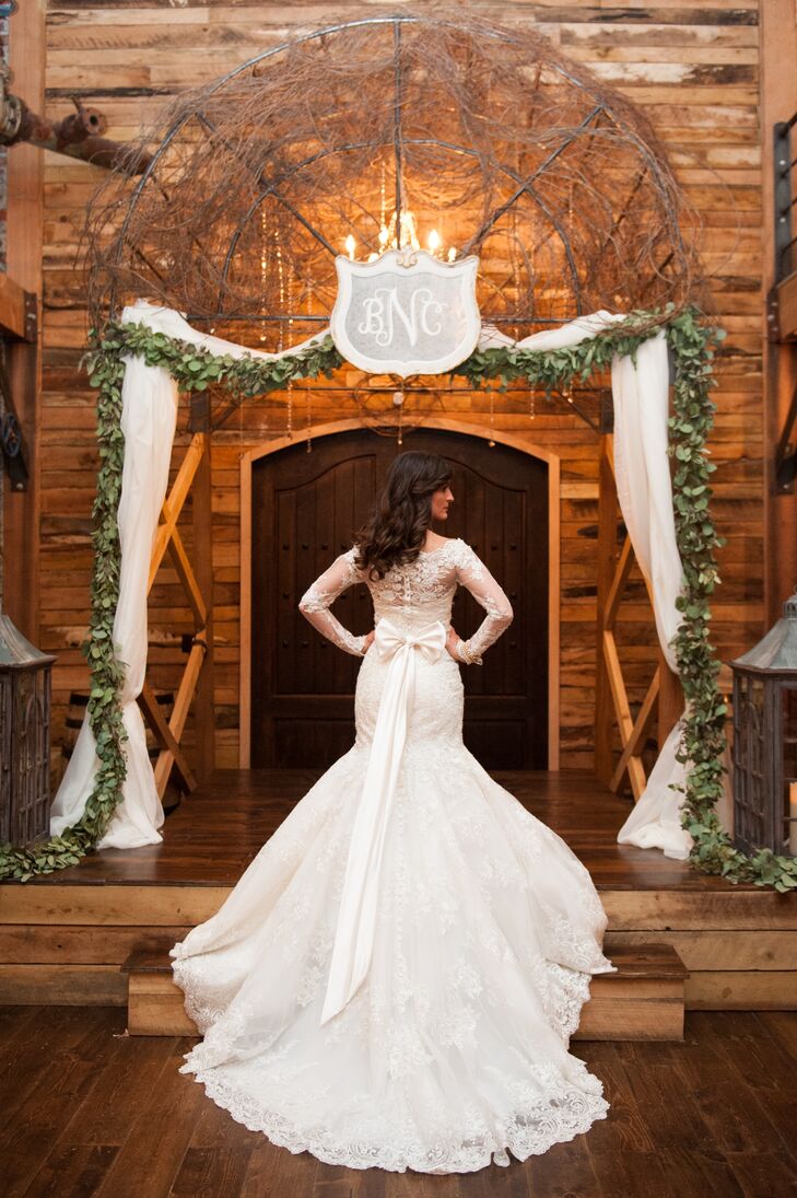 Brooklyn was a classic beauty in her long-sleeve lace gown, perfect for a winter wedding. Her dress was mermaid style paired with a cathedral-length lace trimmed veil and a dramatic bow tied in the back.