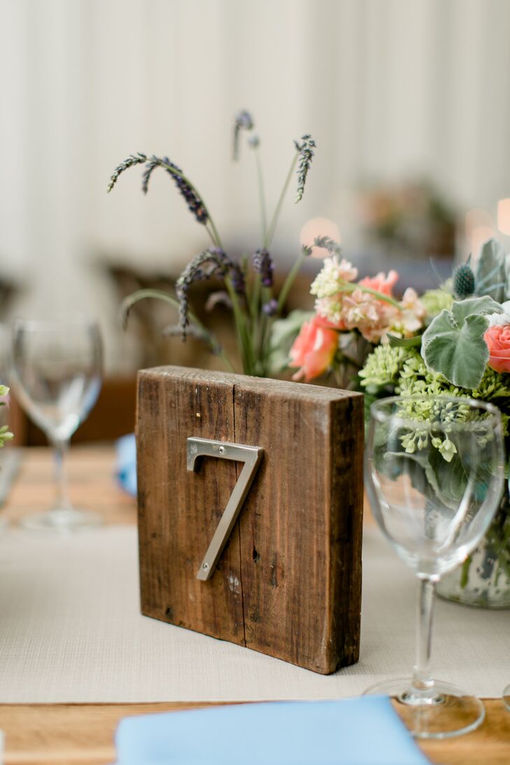 Silver table numbers were attached to small wooden squares, adding to the rustic ambiance.