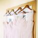 "I gave my sisters free reign over what they wanted to wear, but none of them ran with that! So we made it more of a collaborative effort," says Anne. "They all loved the Amsale tulle dress collection and the idea that each could choose a silhouette that most flattered their own physique. I knew I wanted a pale blush or slate/grey, but given it was a summer wedding, we went with the blush."