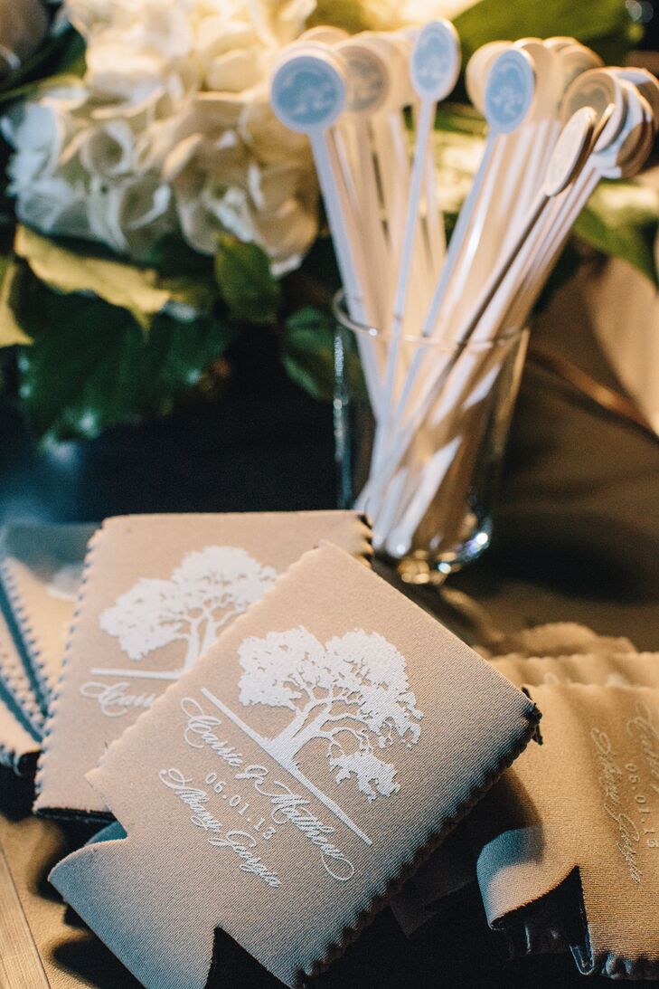 The couple gave personalized koozies with their names and wedding date below an oak tree.
