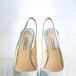 The bride wore light blue Prada slingbacks with a peep-toe.