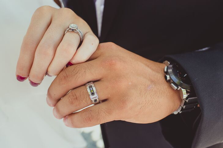 Tina and Erik's hands were gently touching with their engagement ring and wedding band showing.