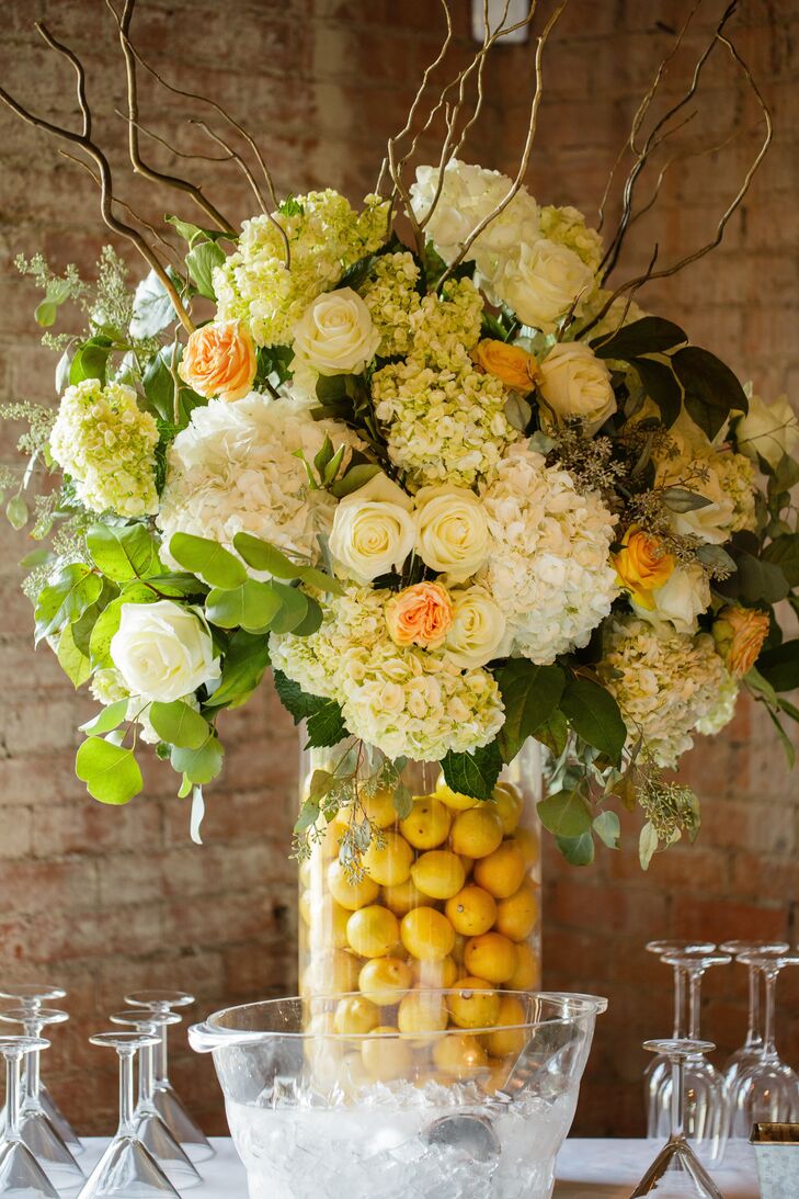 A lemon-filled vase added a fresh, playful touch to the floral centerpieces.
