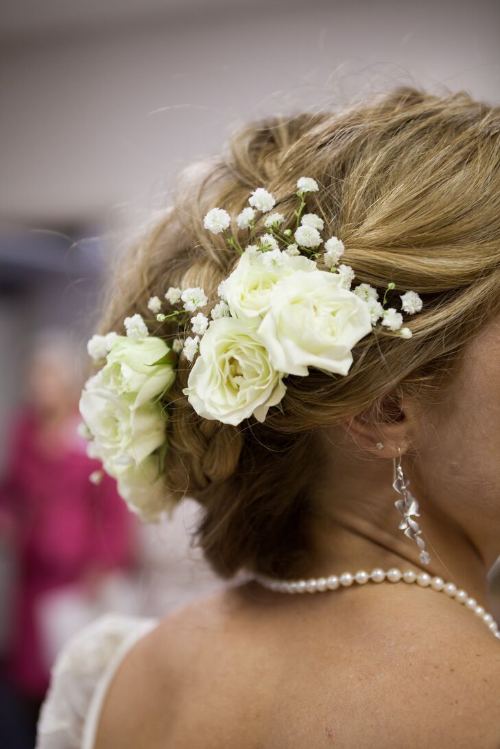 As a finishing touch, Mallory's hairstylist added a cluster of fresh ivory roses to her updo.
