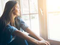 Woman looking out the window