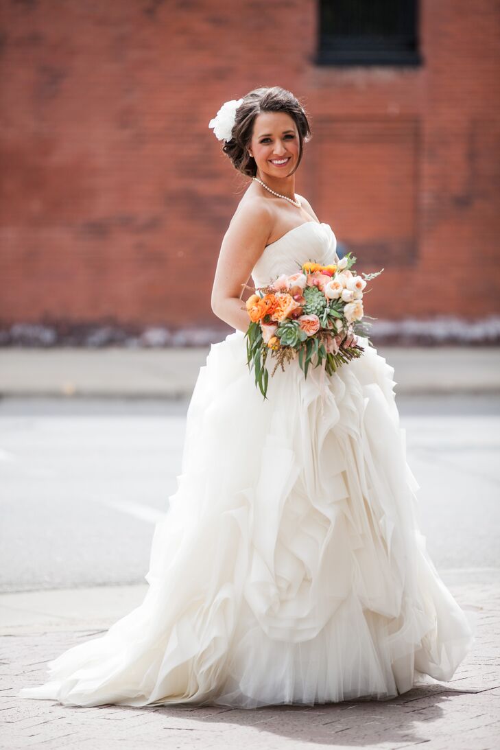 "I mean, seriously, does Vera do anything wrong?" Molly says. She immediately fell in love with this Vera Wang ball gown at L'Atelier in Minneapolis, Minnesota. She loved the organic feel with its funky ruffled skirt and ruched bodice. Even more, it fit her like a glove.