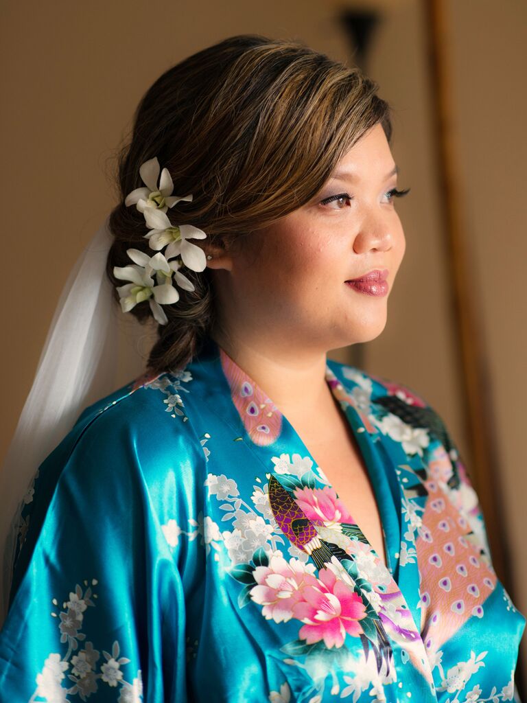 wedding hair flowers small orchids atop low side bun